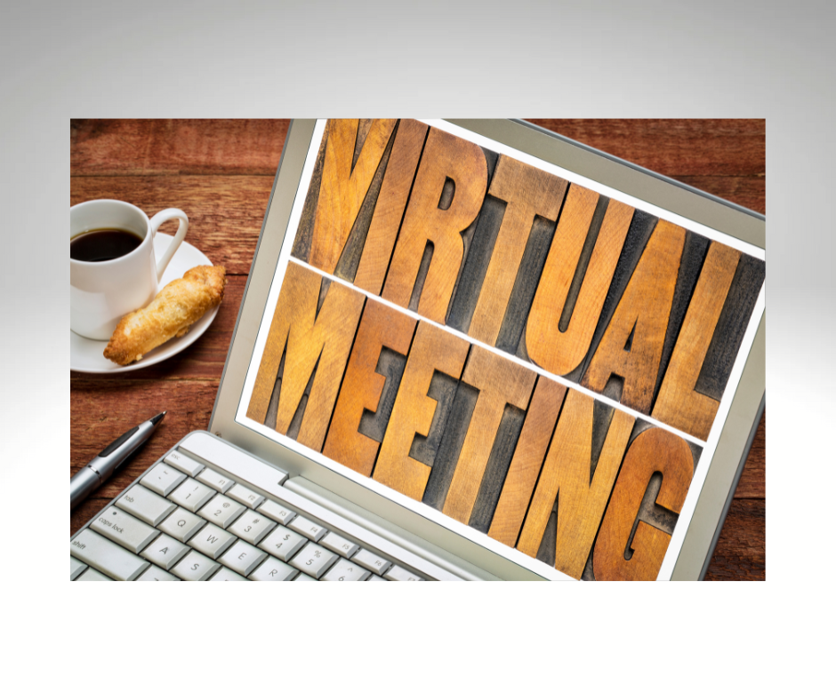 Open laptop displaying the words "virtual meeting."